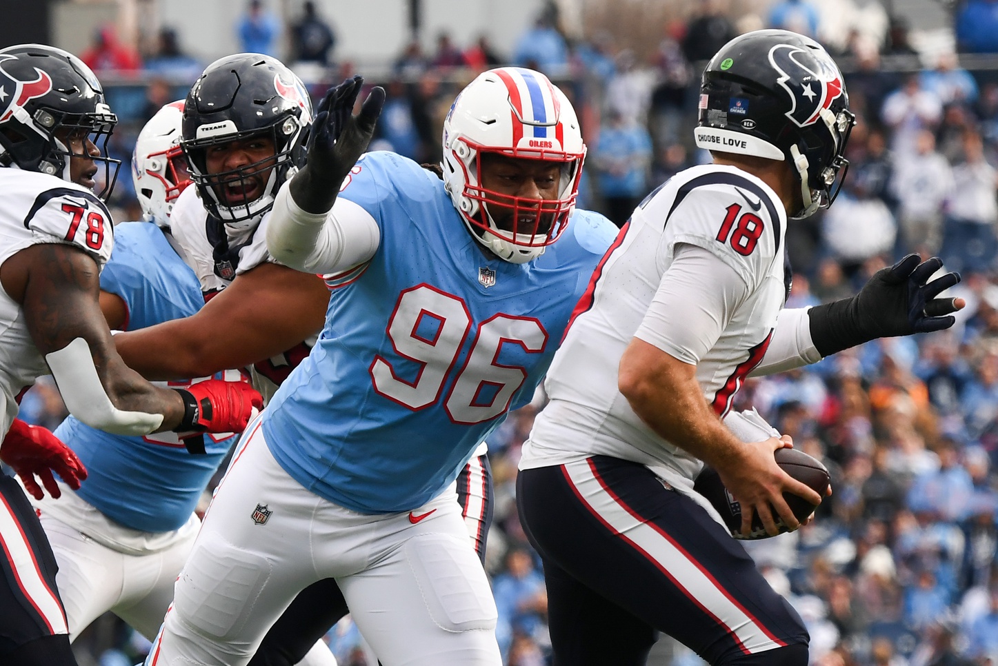 Dec 17, 2023; Nashville, Tennessee, USA; Houston Texans quarterback Case Keenum (18) is sacked by Tennessee Titans defensive end Denico Autry (96) during the second half at Nissan Stadium.